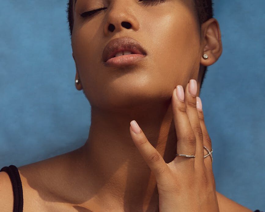 close up photo of a closed eyed woman