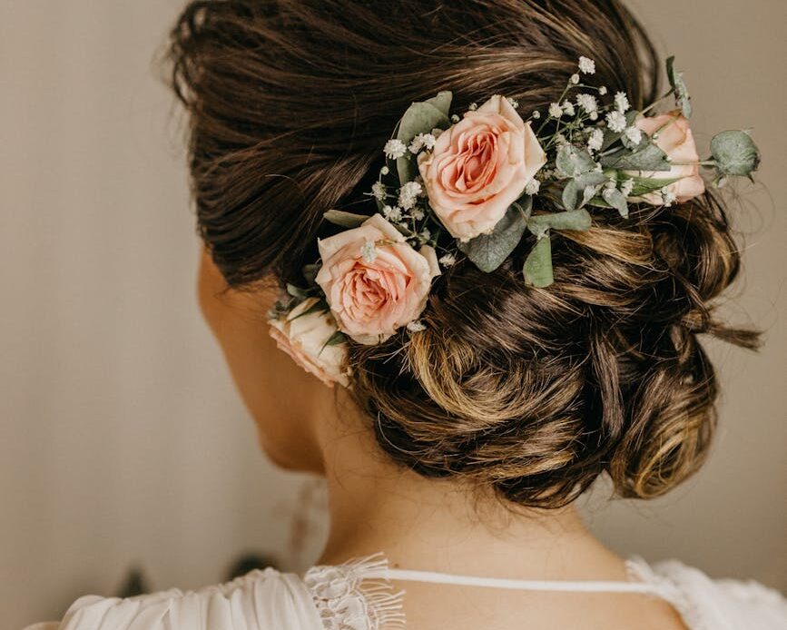 woman in wedding updo with flowers in hair