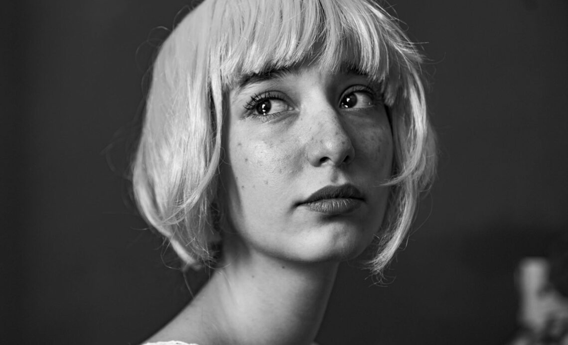 headshot portrait of a woman in black and white