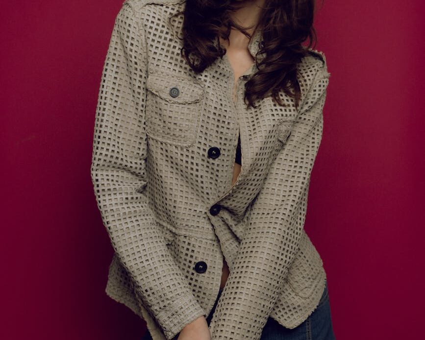 a woman in a jacket posing for a photo