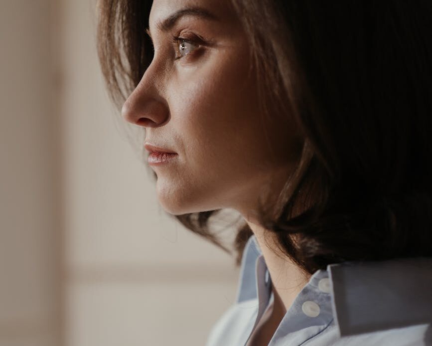 woman in white collared shirt