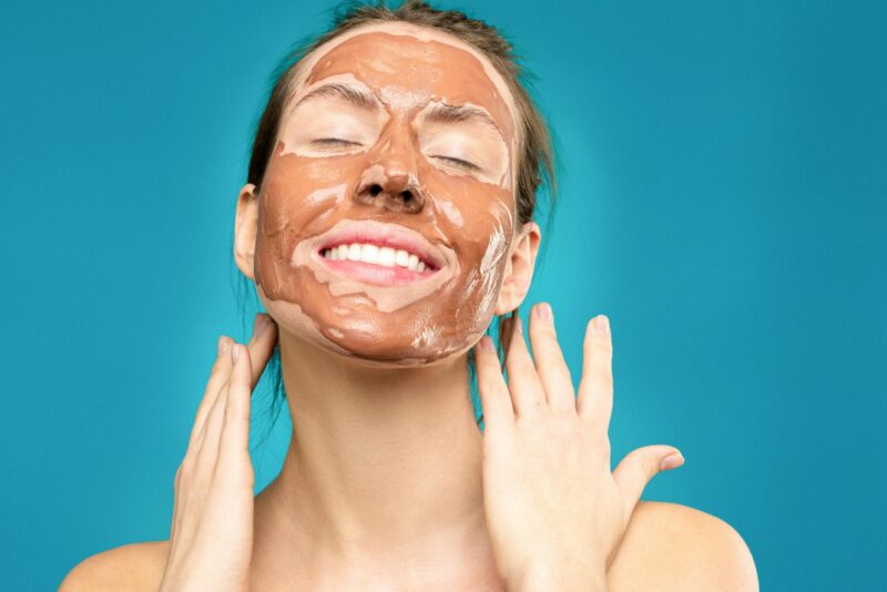 woman with clay mask on face