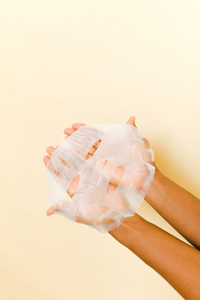 person holding a face mask