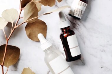 bottles with exfoliating serum on a marble counter