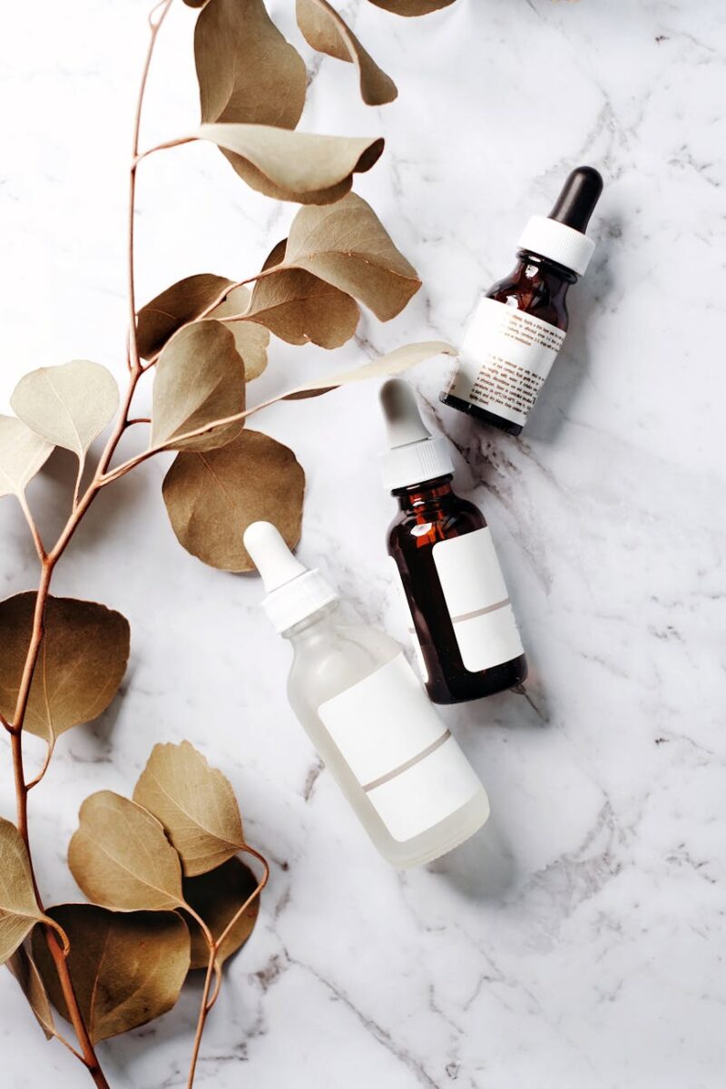 bottles with exfoliating serum on a marble counter