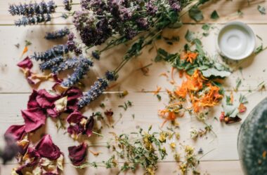 dried flowers and petals on a wooden table