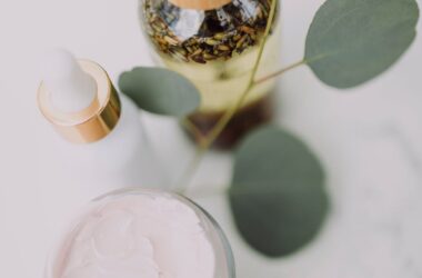 white and brown bottle on white table