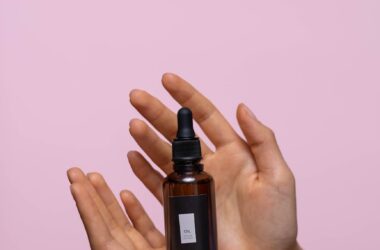 person holding a bottle of serum