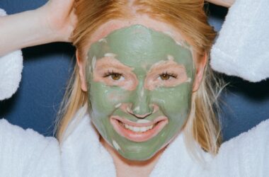 a woman wearing a mud mask