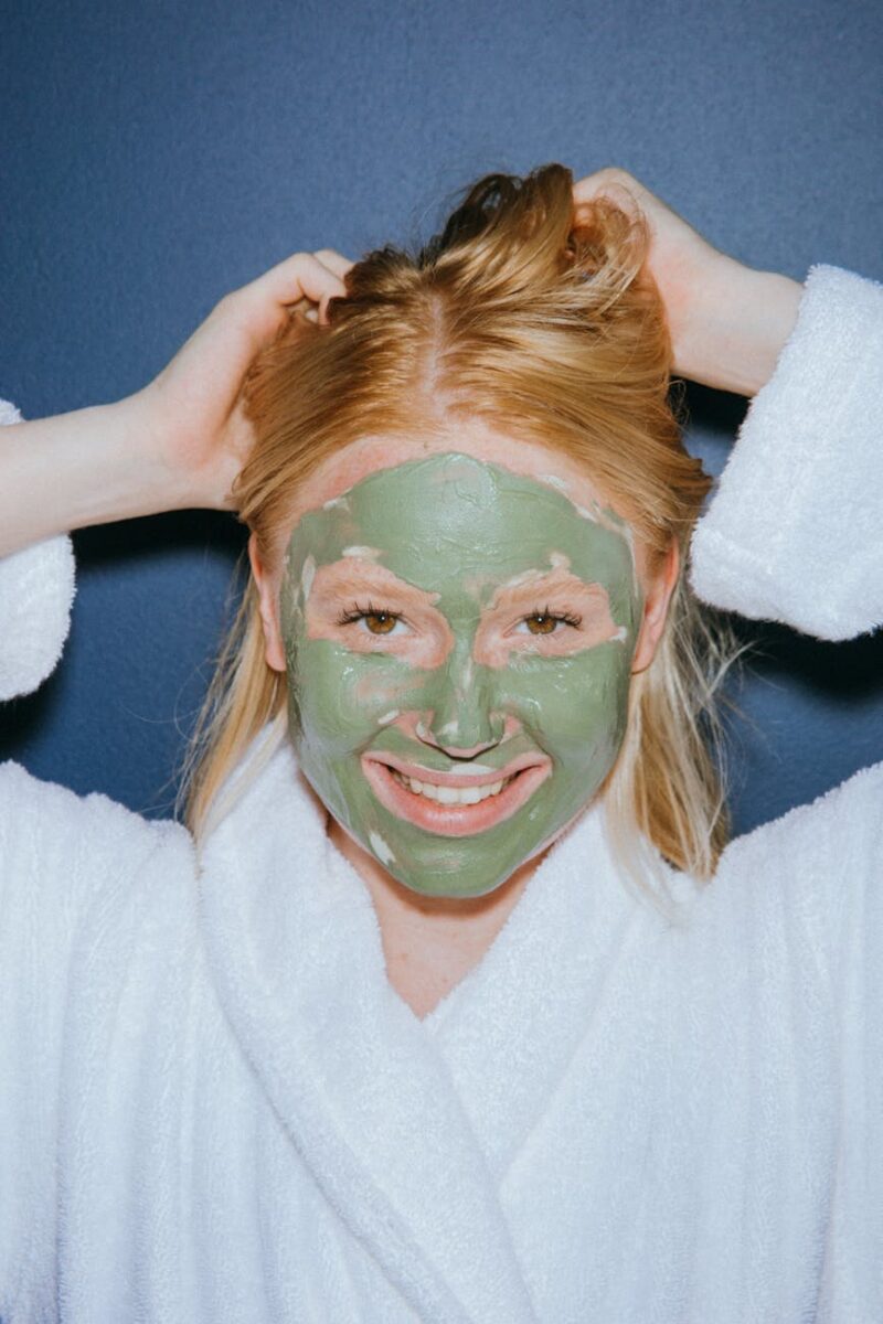 a woman wearing a mud mask