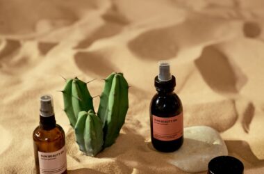 cosmetic products on a beach sand