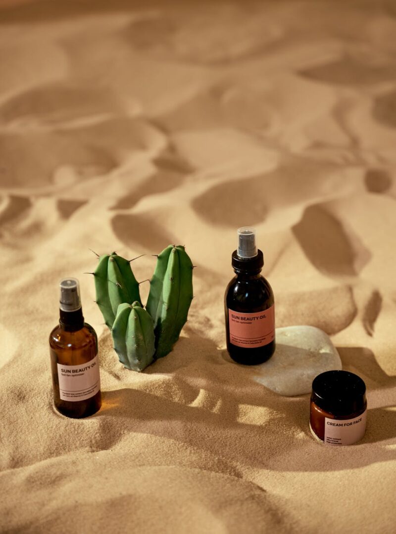 cosmetic products on a beach sand