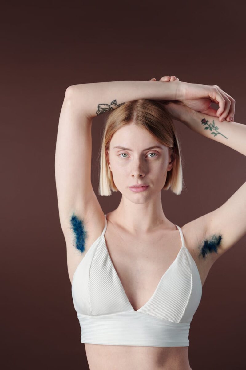 woman in white tank top with axillary hair