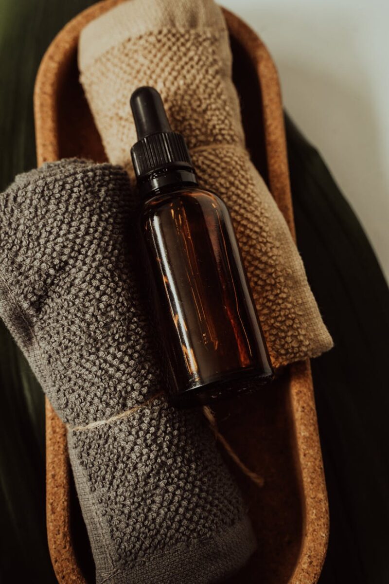 brown bottle on towels