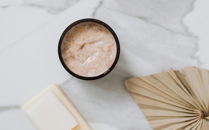 body scrub in black round container