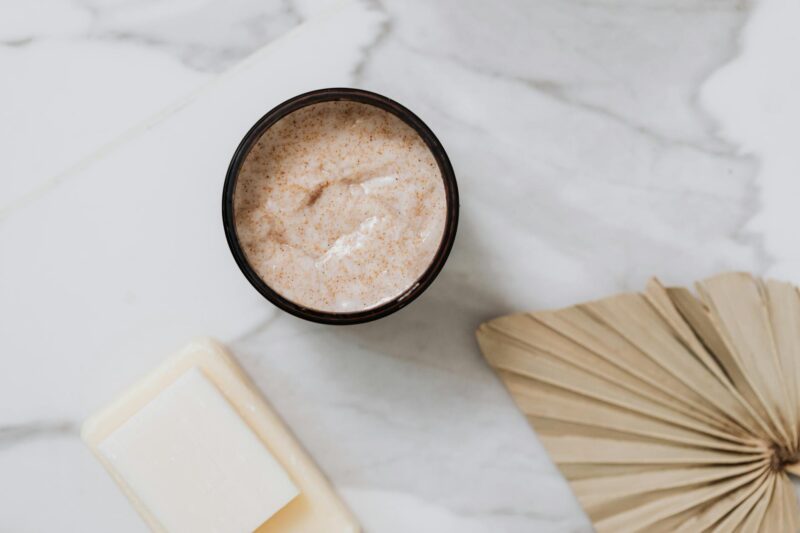 body scrub in black round container