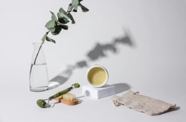 close up photo of beauty product and a facial roller